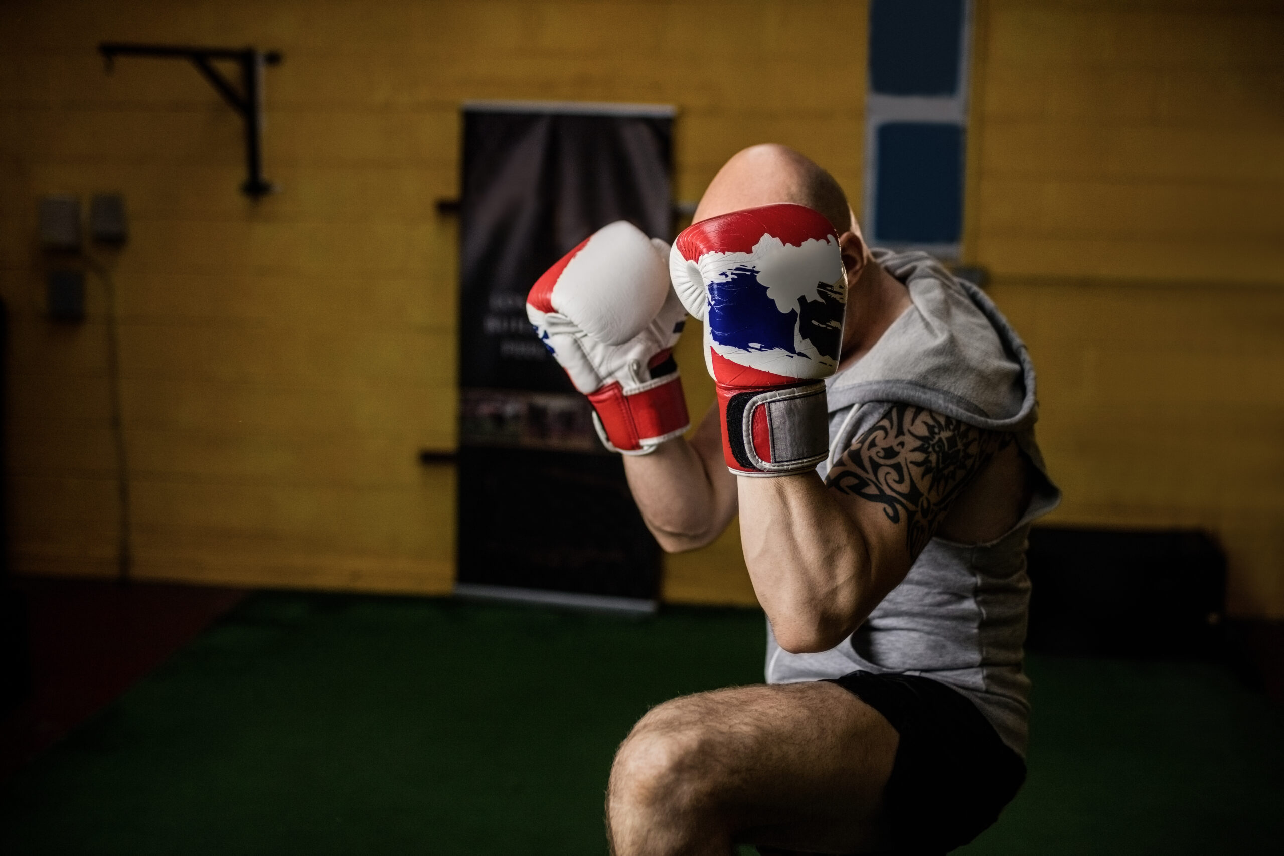 Thai boxer practicing boxing in the fitness studio